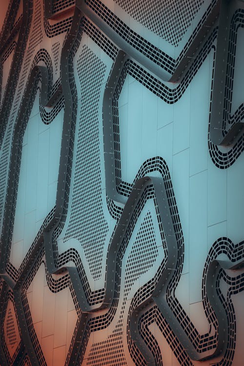 Photo of a Steel Futuristic Decoration on a Wall