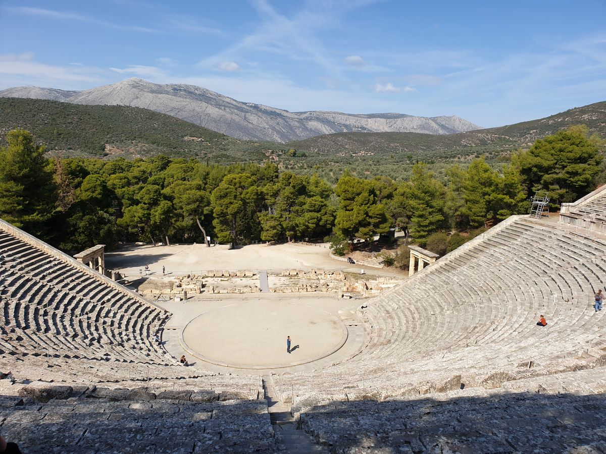 The theatre of Epidaurus — 55 rows of stone seating whose 2,400-year-old acoustics remain unmatched.