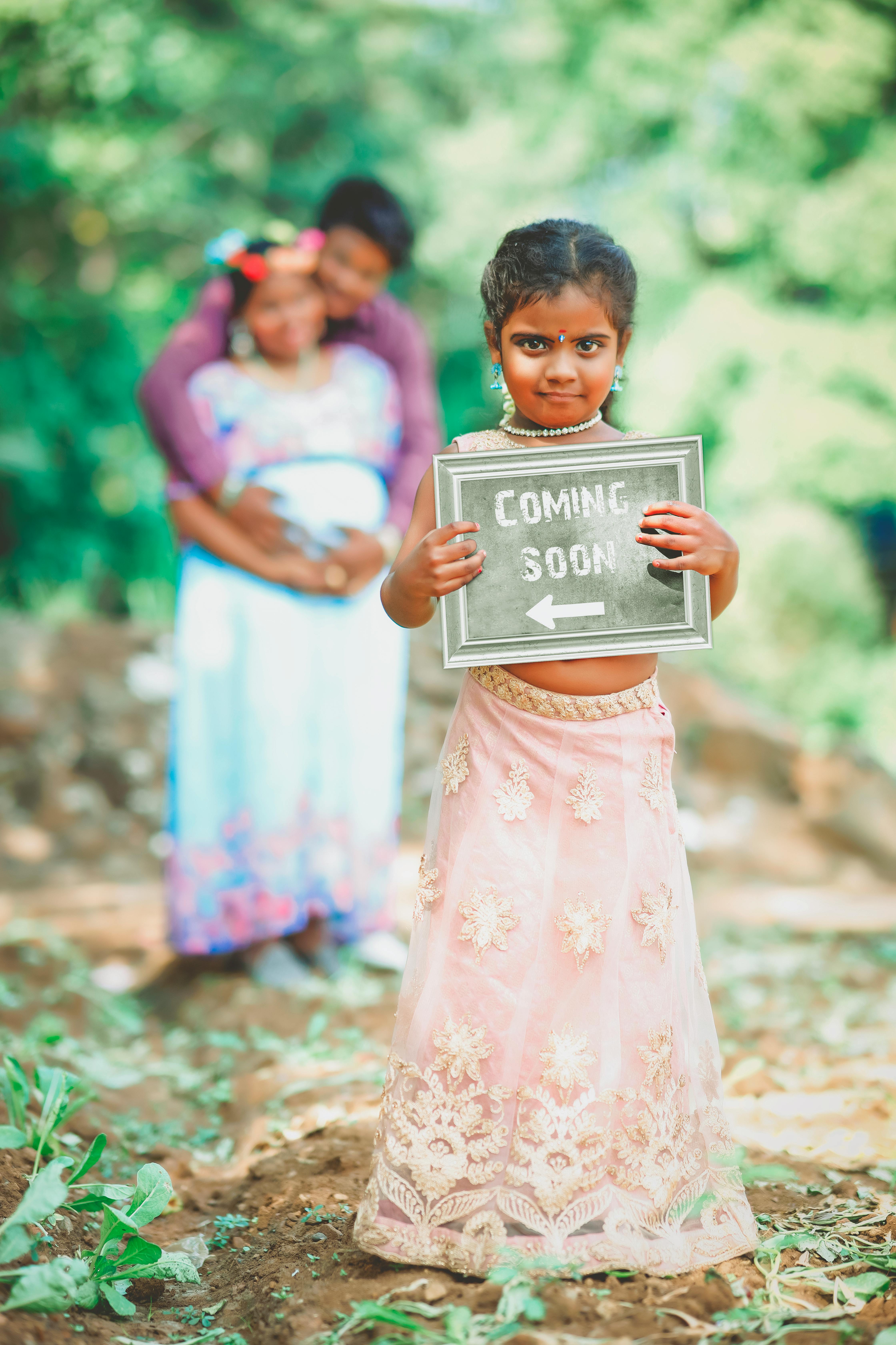 a girl holding a poster