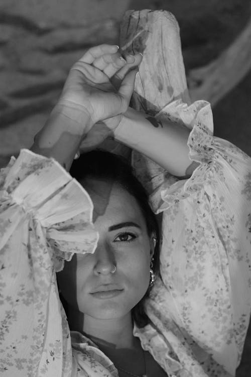 Black and White Photo of a Beautiful Woman Wearing a Floral Top