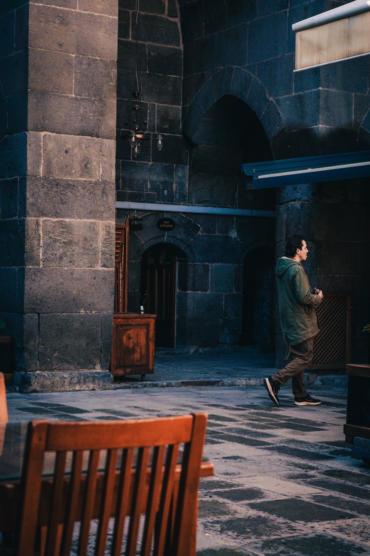 Man Walking Inside A Building