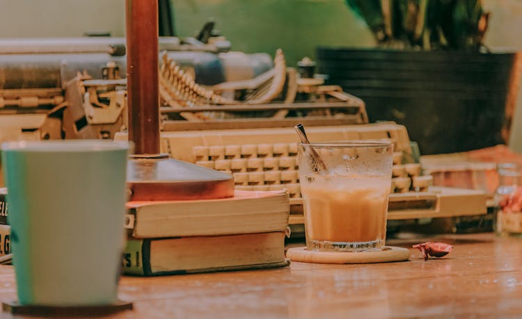 Glass On Top Of Table Beside Books