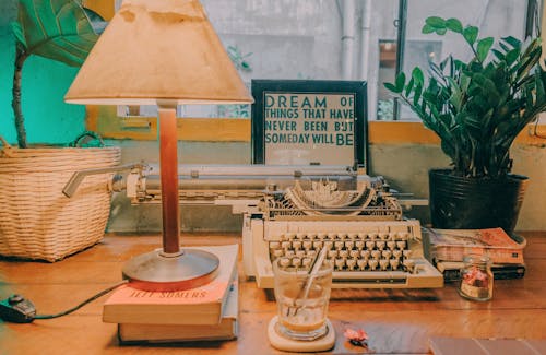 Free Table Lamp Near Typewriter Stock Photo