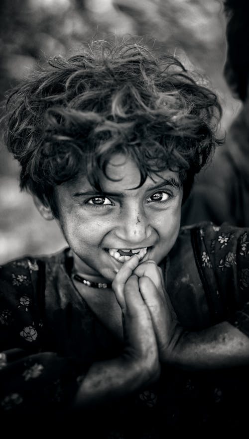 Smiling Girl with Her Hands Together