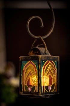 Captivating stained glass lantern illuminating with a warm candle glow in a vintage style.