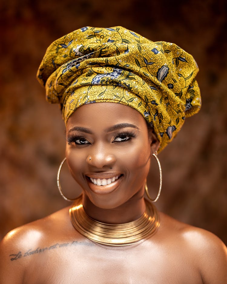 A Portrait Of A Woman In A Headwrap