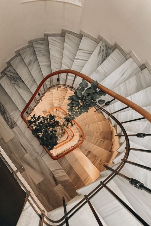 Free A stunning high angle view of a spiral staircase adorned with elegant potted plants in Istanbul. Stock Photo