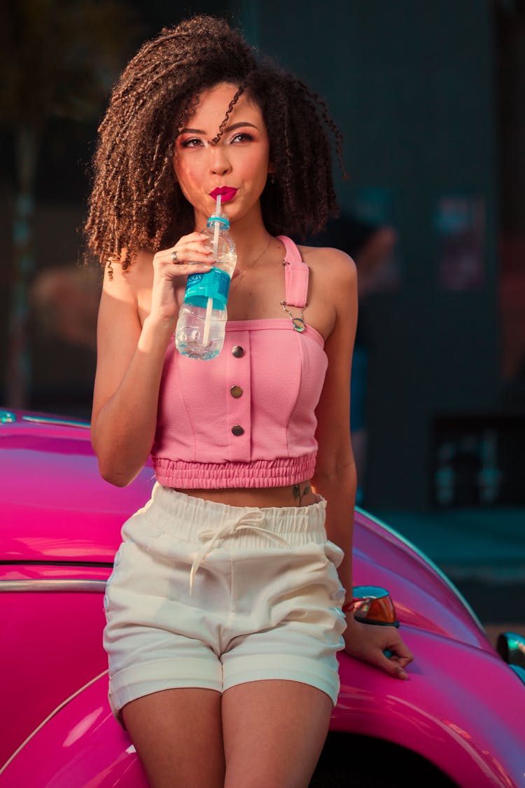 Woman Drinking From A Straw