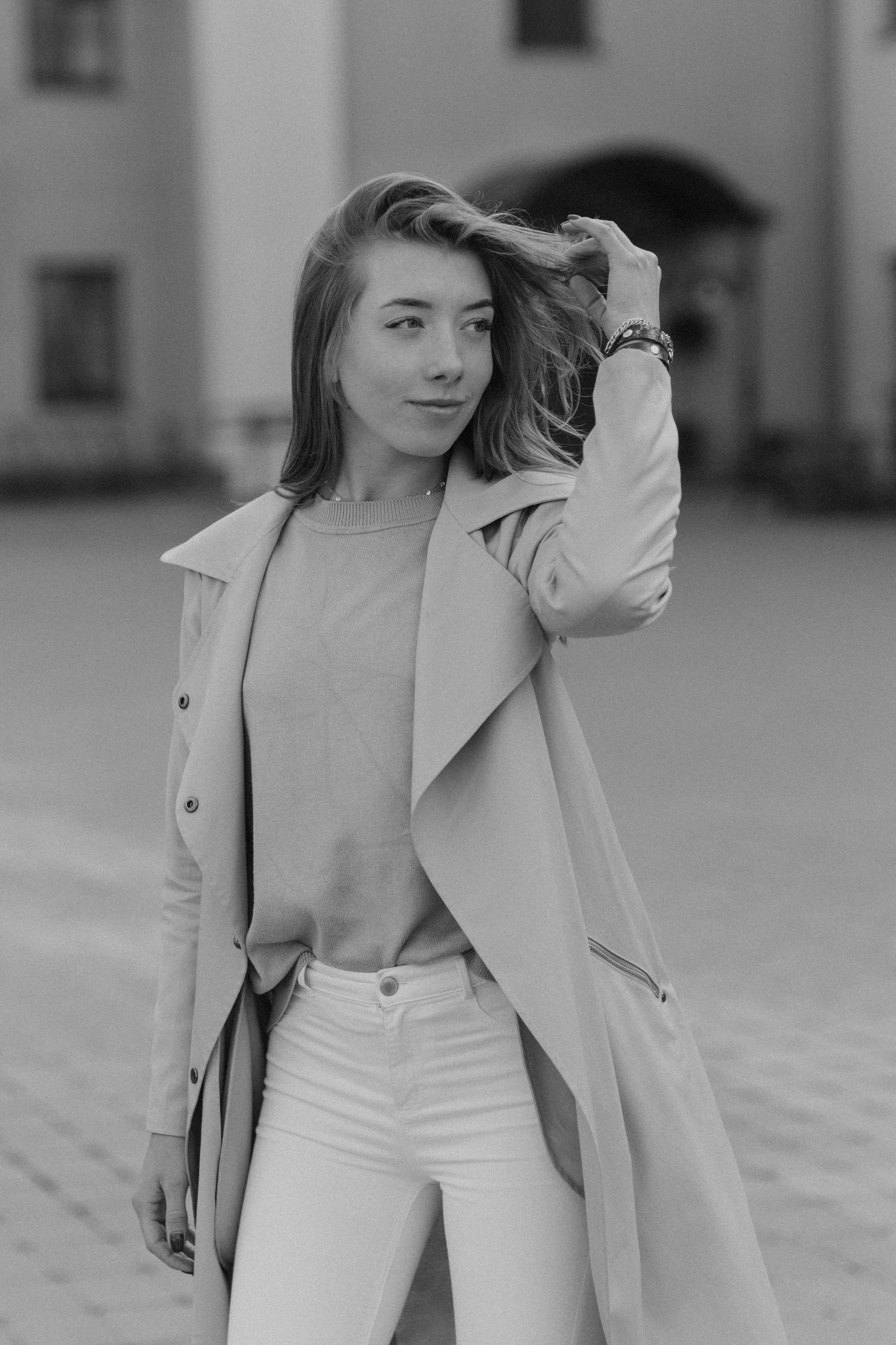 Grayscale Photo of a Woman in Trench Coat Standing on Road · Free Stock ...