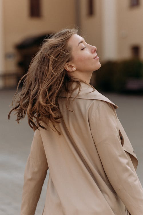 Woman Wearing Coat on City Street