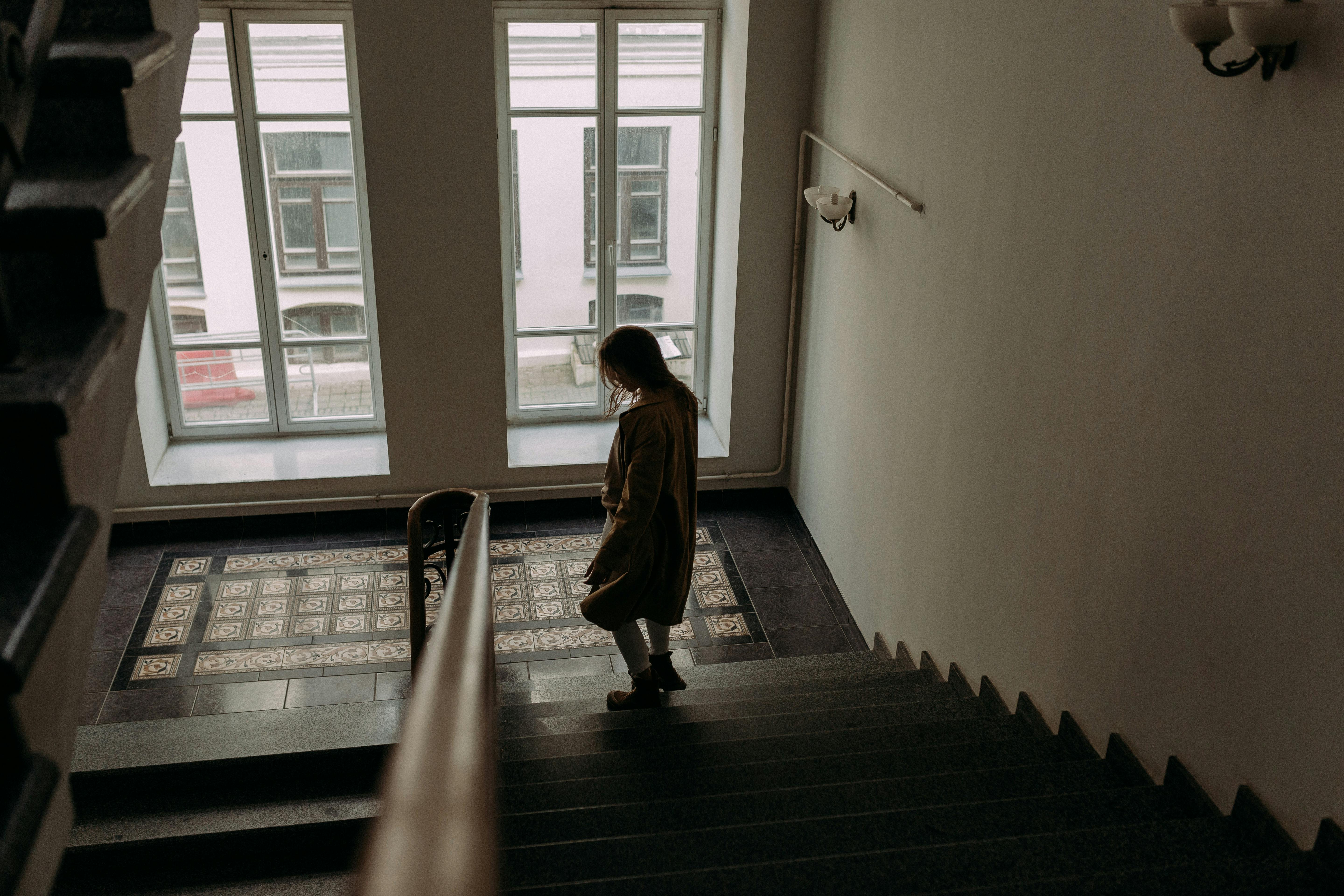 Physical Scene Depicting A Group Of Friends In A Conversation, With One Person Looking Uncomfortable As Another Points To A Past Mistake On A Piece Of Paper Or A