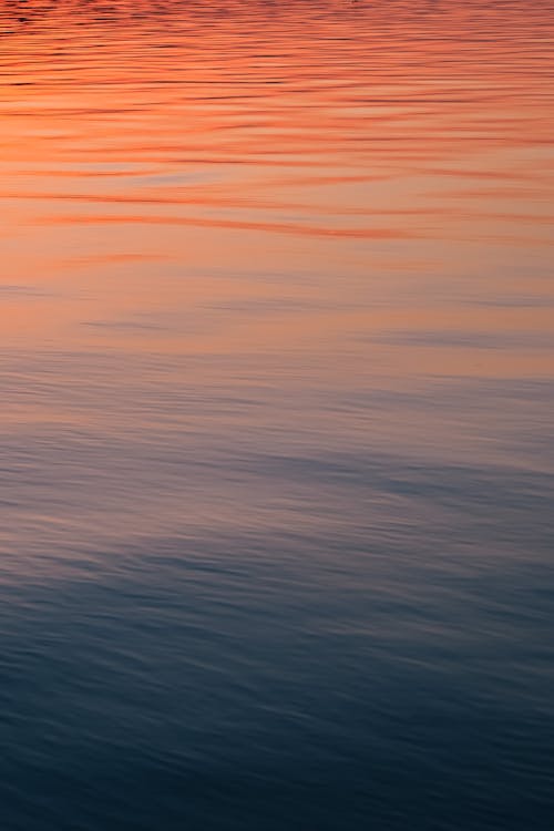 Calm Water Surface at Sunset