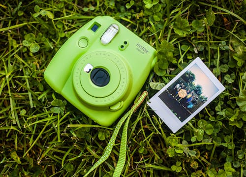 Free Close-Up Photography of Camera on Grass Stock Photo