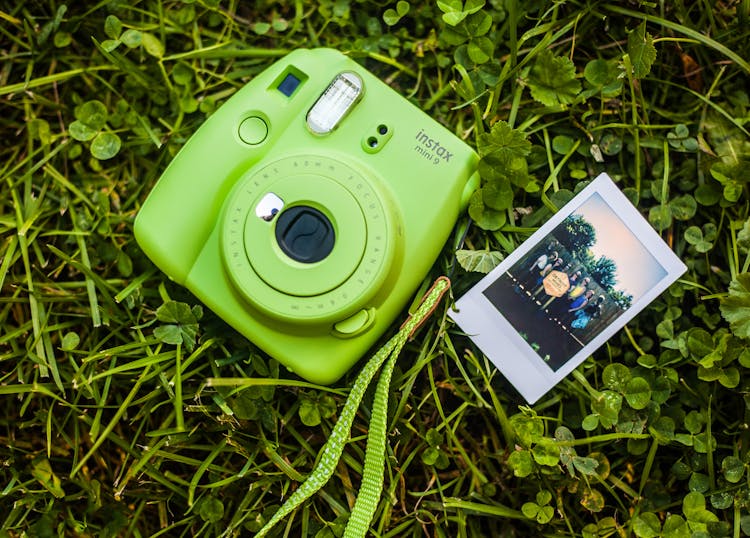 Close-Up Photography Of Camera On Grass