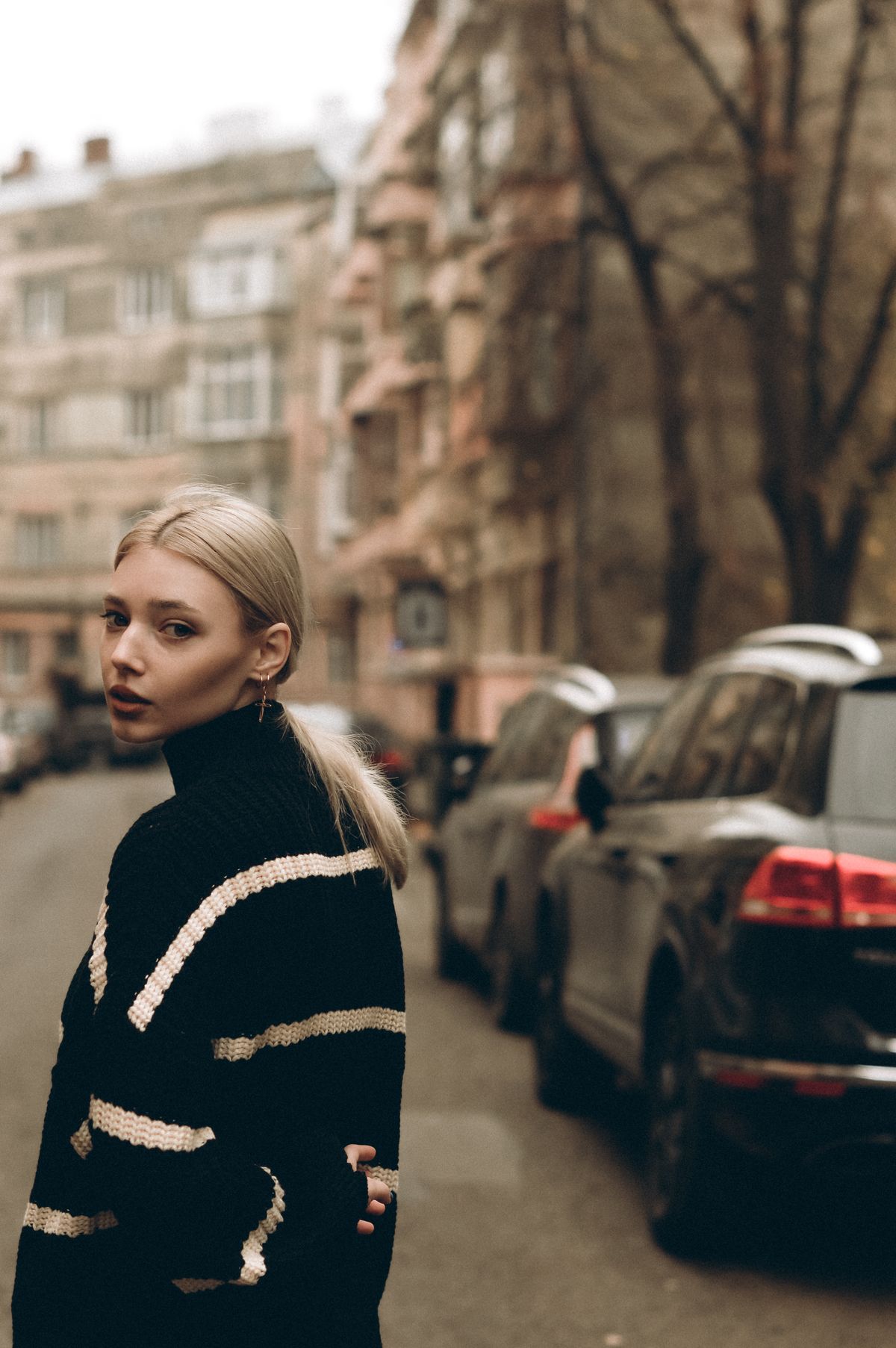 Editorial fashion image illustrating relaxed striped knitwear styling