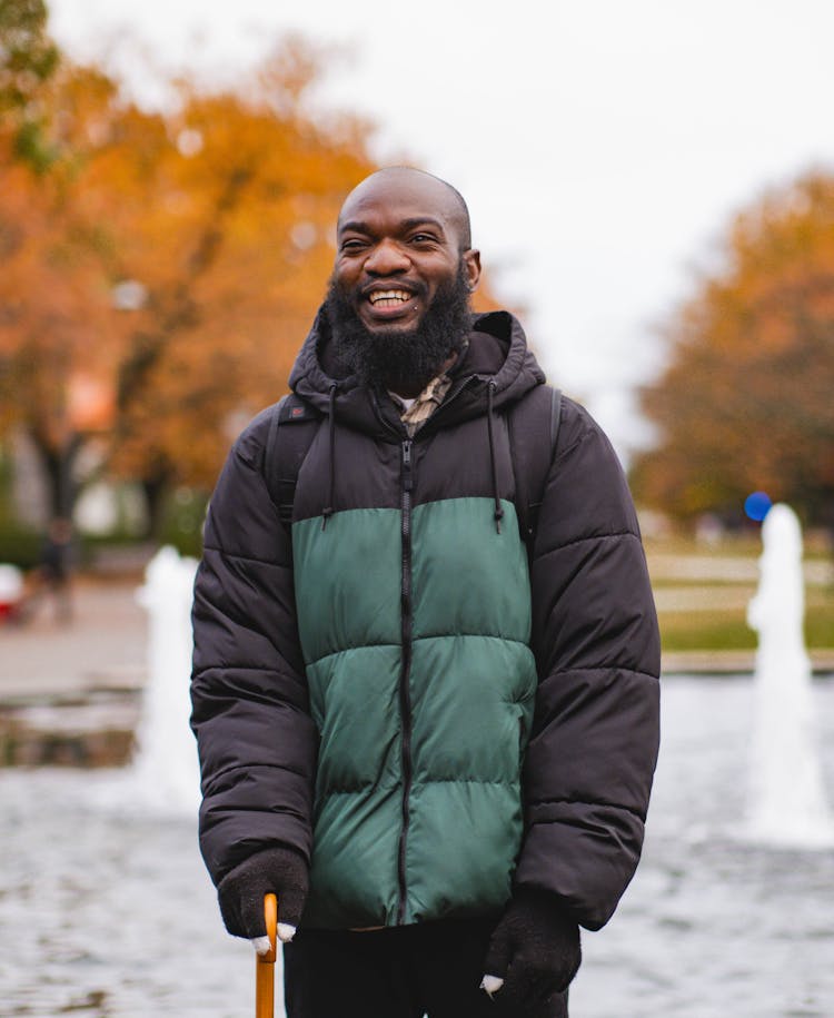 A Man Wearing A Puffer Hoodie Jacket