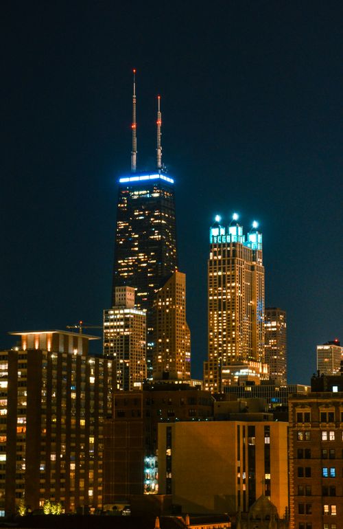 Free Stunning nighttime view of Chicago's illuminated skyline with prominent skyscrapers. Stock Photo