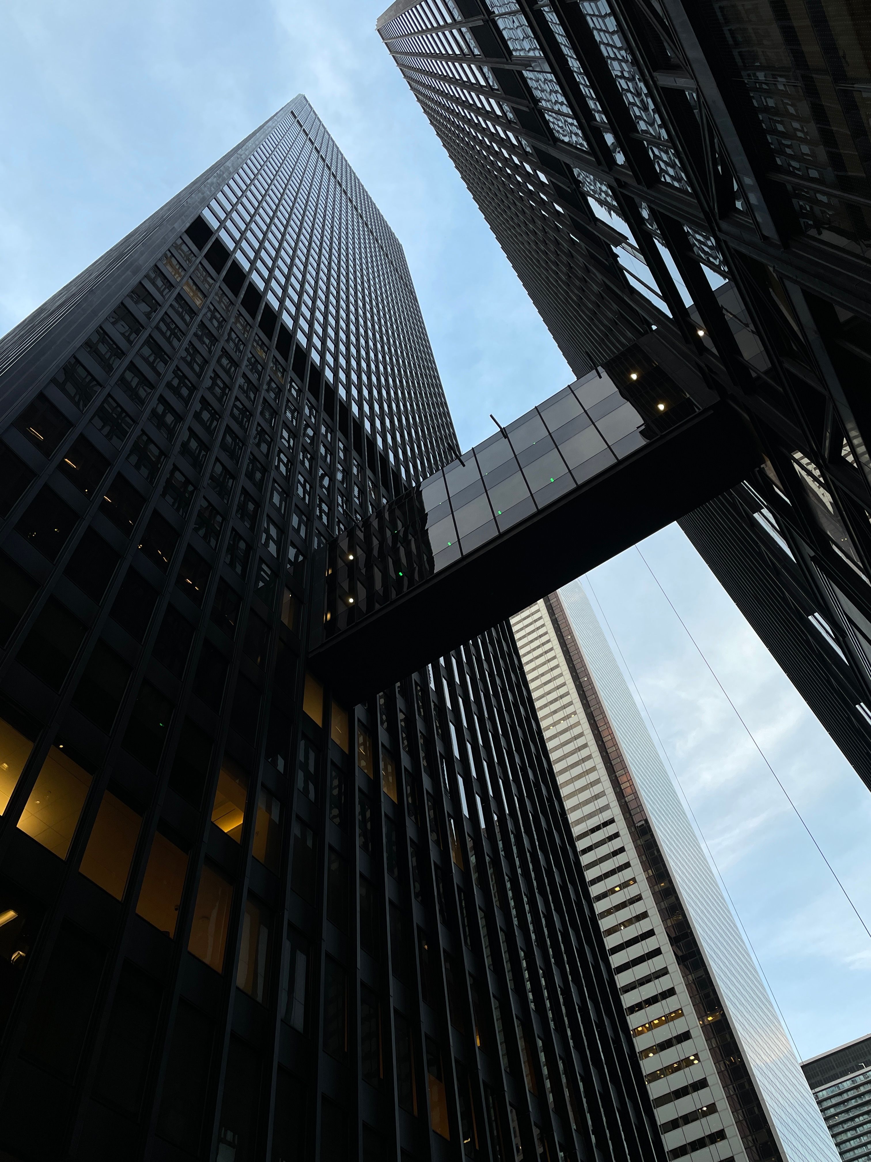 A Low Angle Shot of High Rise Buildings Under the Blue Sky · Free Stock ...