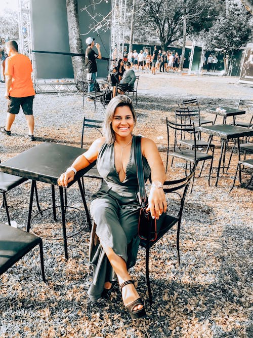 Woman Sitting on Black Chair