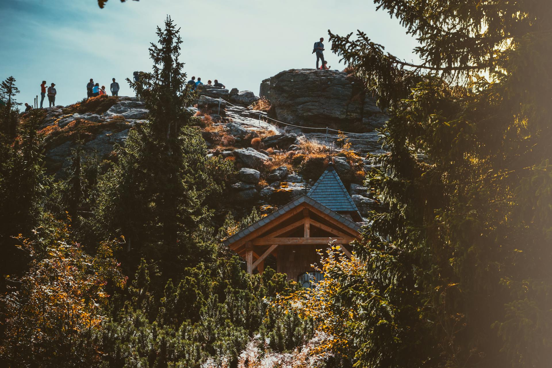 Tourists hike through a scenic rocky landscape in Bayerisch Eisenstein, Germany.