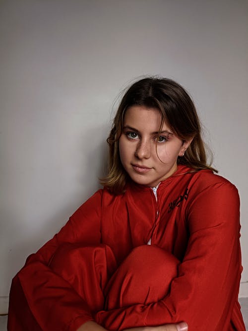 A Woman in Red Jacket and Red Pants
