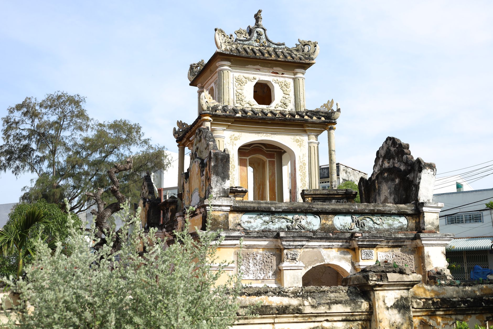 Explore this ancient pagoda showcasing intricate architectural details and weathered stone carvings.