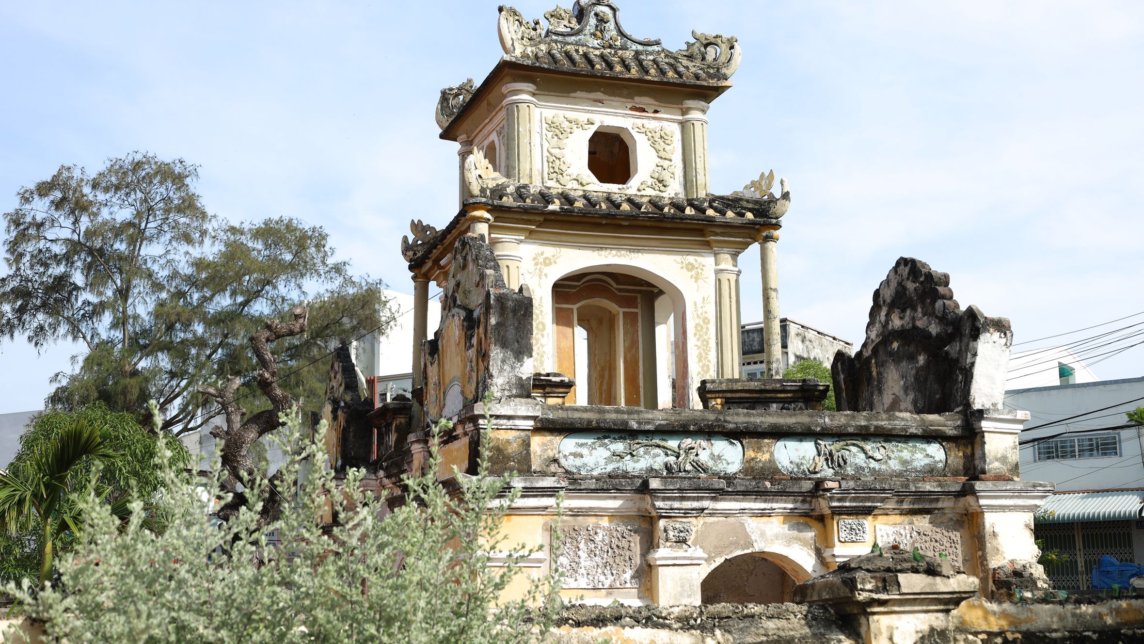 Explore this ancient pagoda showcasing intricate architectural details and weathered stone carvings.