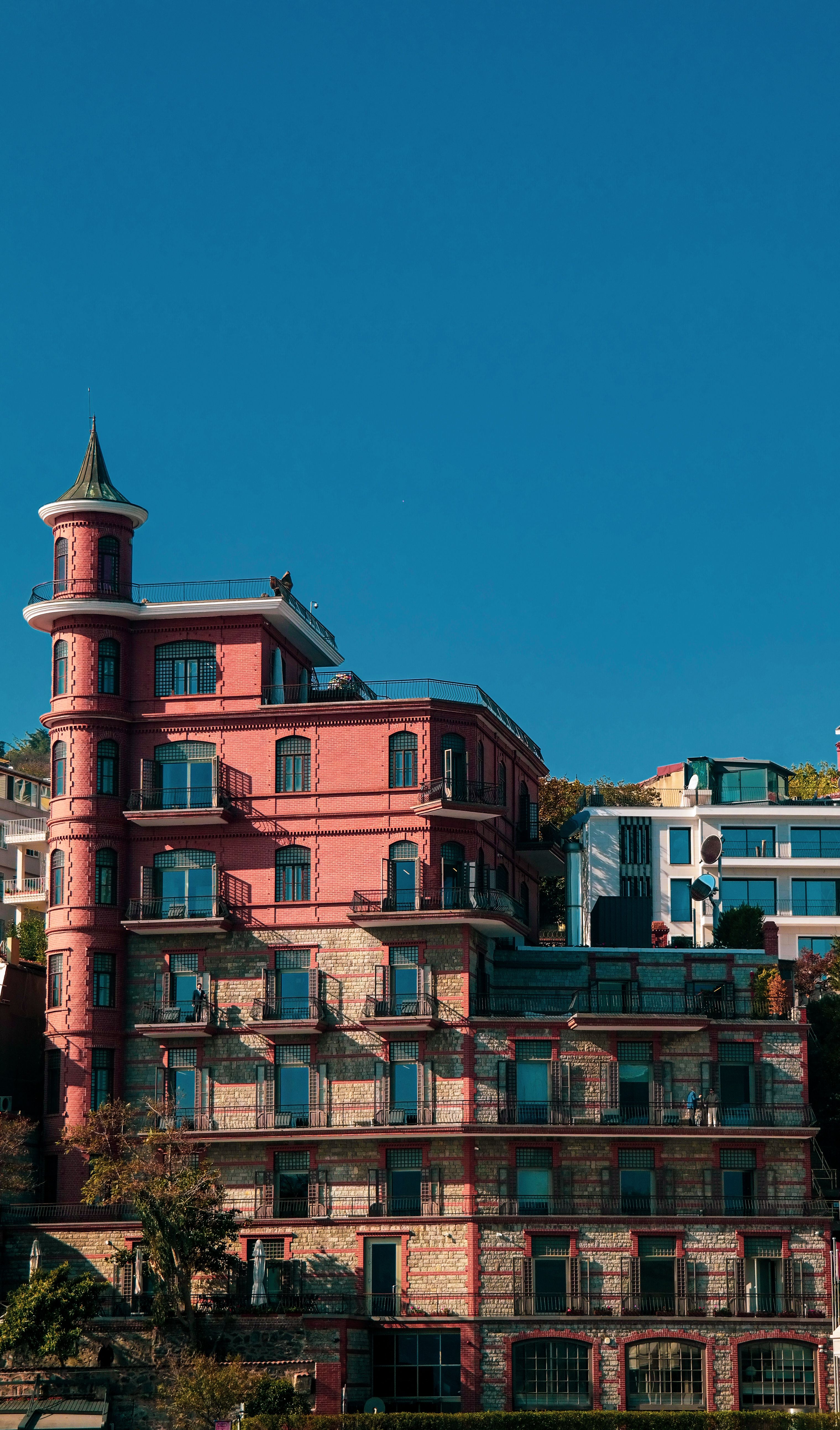 Red Brick Building Under Blue Sky · Free Stock Photo