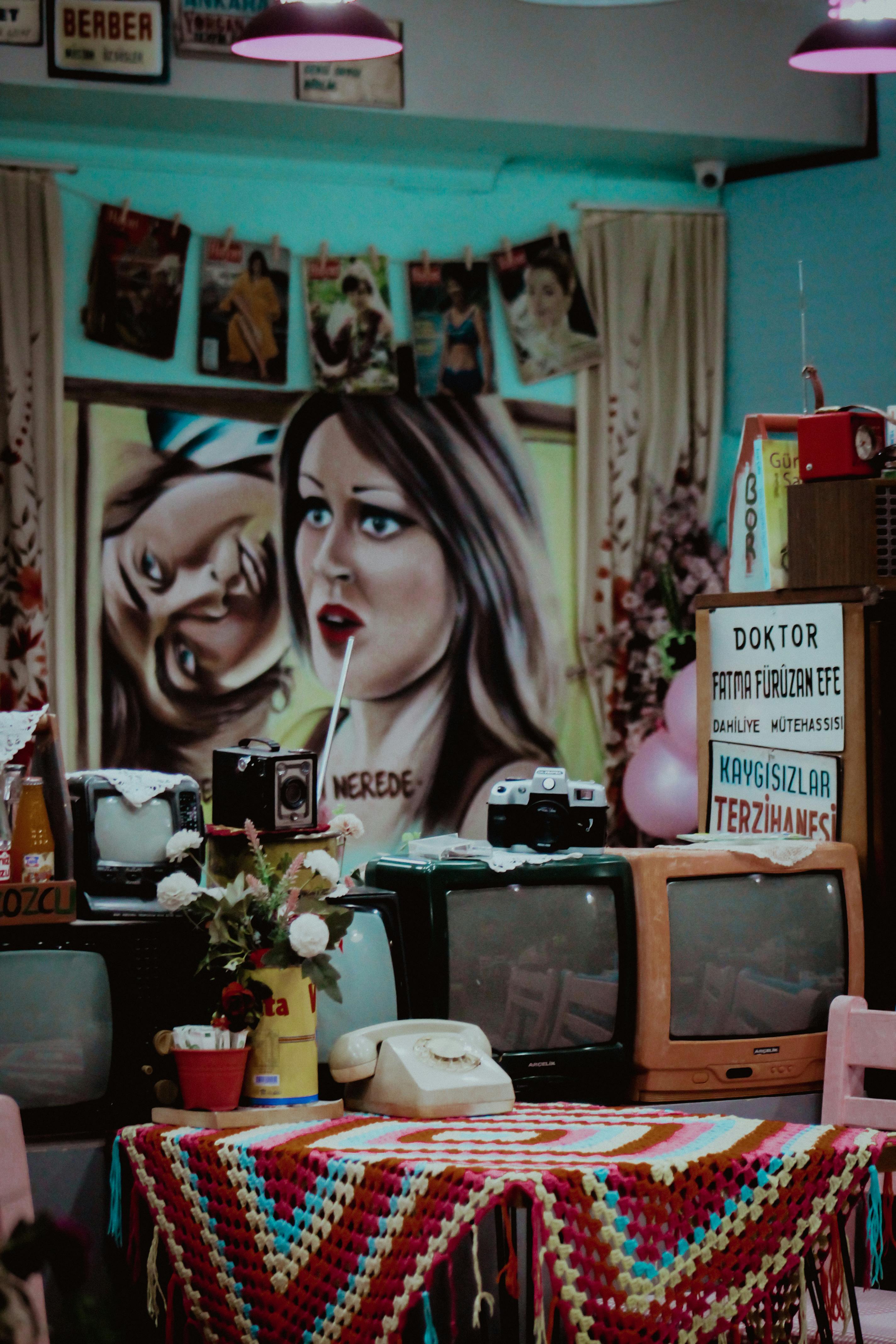 Colorful retro-themed room with vintage TVs and decor in Istanbul, Turkey.