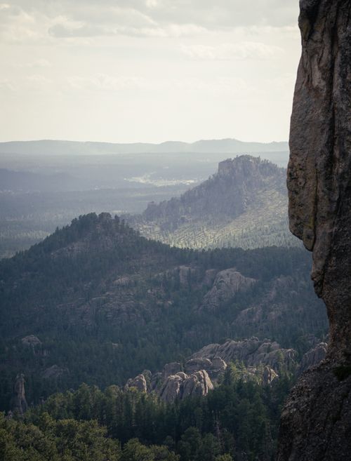 Free Explore the serene mountainous landscape with lush forests and rocky formations. Stock Photo