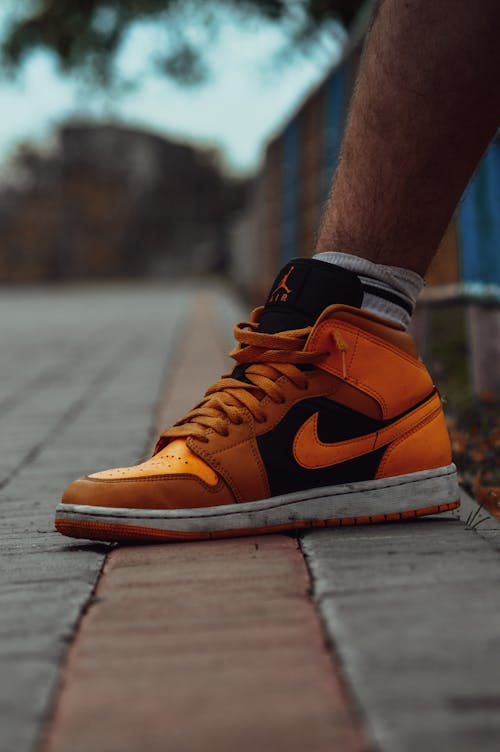 Close-Up Photograph of an Orange Sneaker