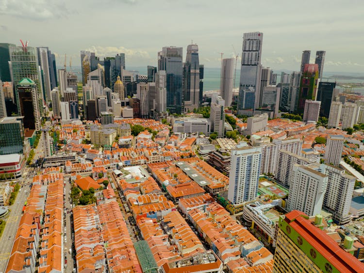 Modern Skyscrapers And Old Small Buildings In City