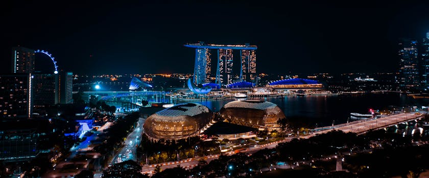 Spectacular night panorama showcasing Marina Bay Sands and Esplanade in Singapore. Illuminated cityscape.