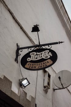 A vintage Pepsi Cola sign outside a cervecería in Badajoz, Spain.