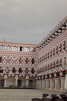 Explore the ornate architecture of an historic courtyard in Badajoz, Spain's old town.