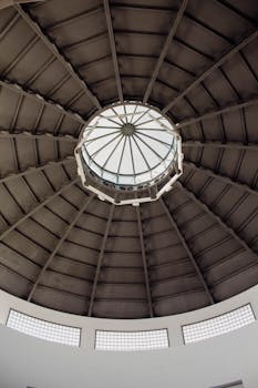 View of a circular modern dome ceiling in Badajoz, Spain, showcasing geometric architectural design.
