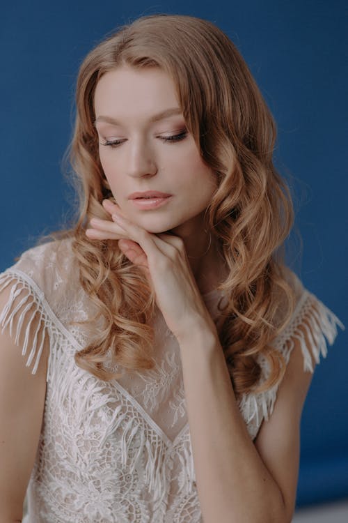 Portrait of a Young Woman in a Lace White Dress