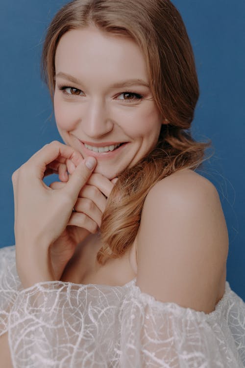 Portrait of a Smiling Bride in a Chiffon Off-the-shoulder Wedding Dress
