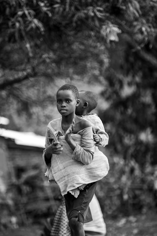 Boy Carry His Brother on Back