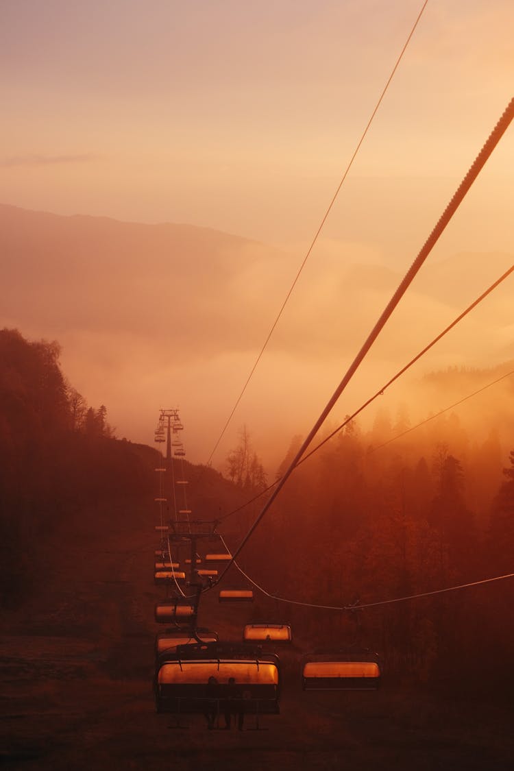 Hoist In Mountains On Sunset