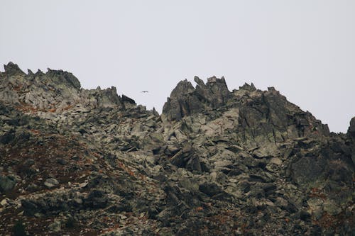 Gray Rocky Mountain Under White Sky