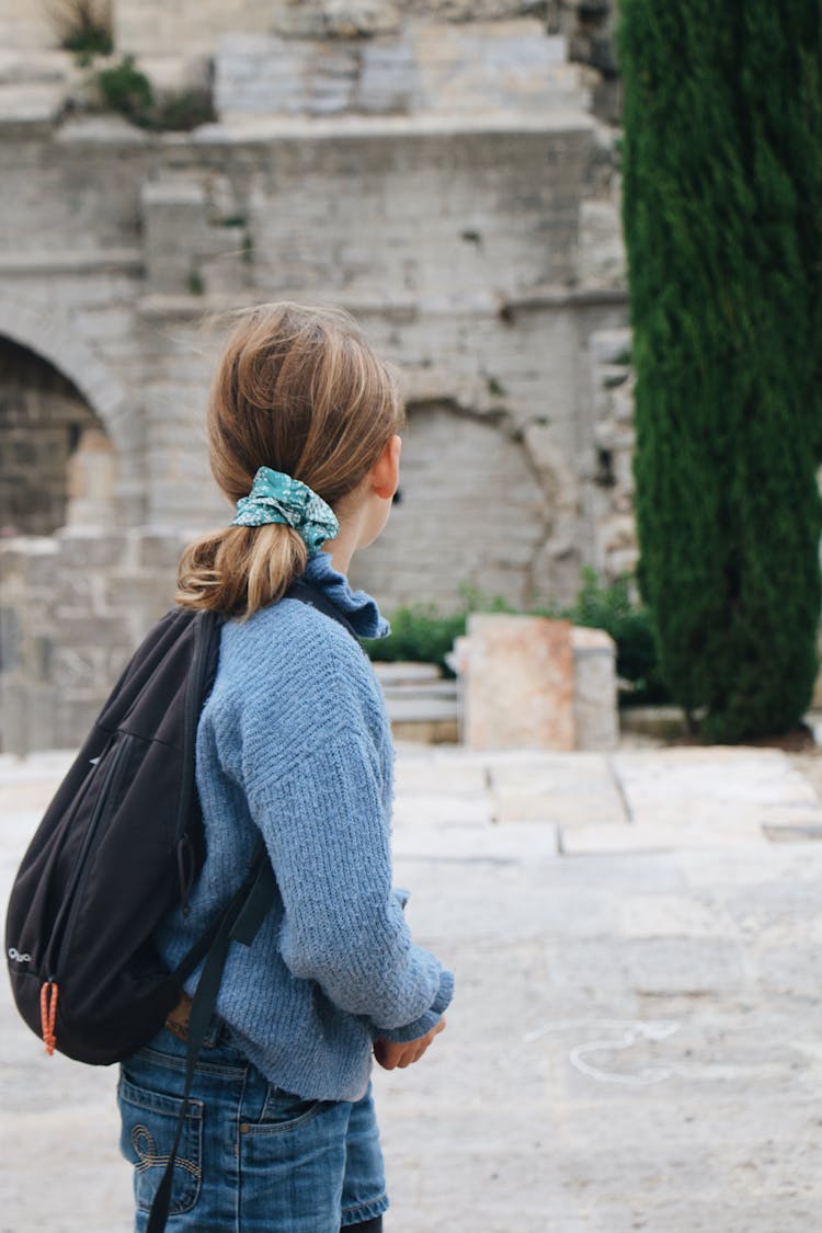 Photograph Of A Girl In A Blue Sweater