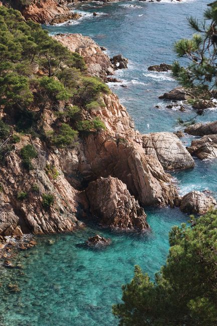 Breathtaking view of rocky cliffs and turquoise sea, ideal for travel inspiration.