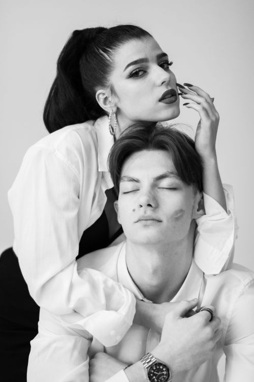 Free Intimate black and white portrait of a couple embracing with romantic expressions. Stock Photo