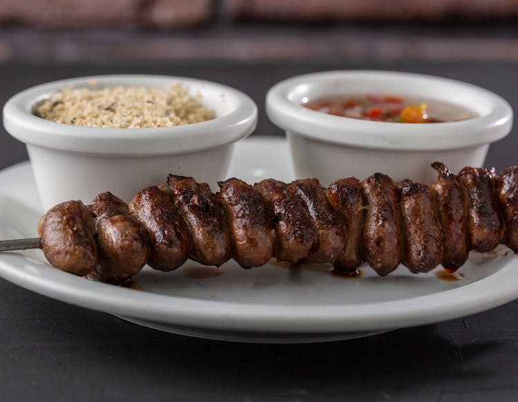 Grilled Sausages On Ceramic Plate