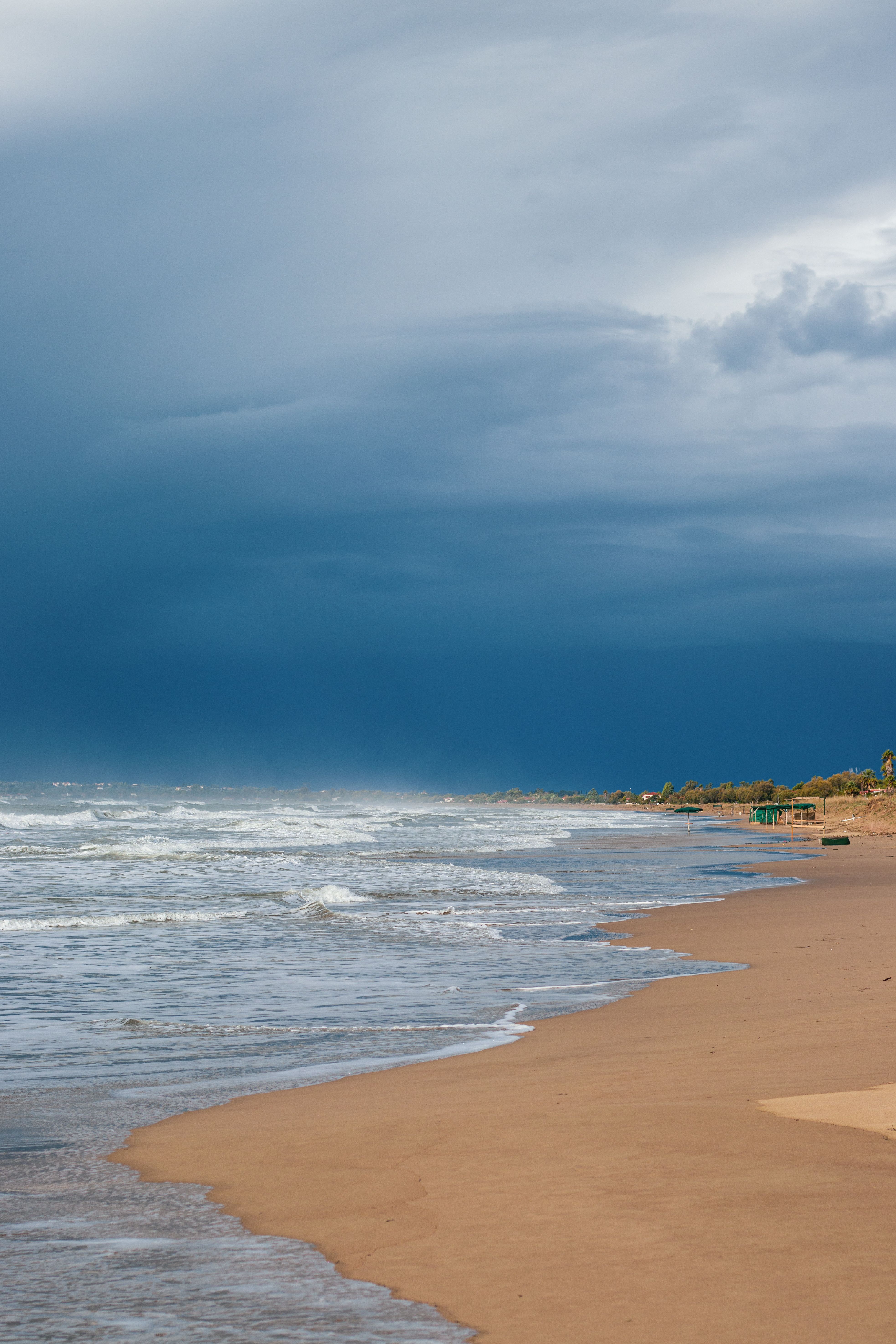 Dark storm clouds gathering over rough ocean waves