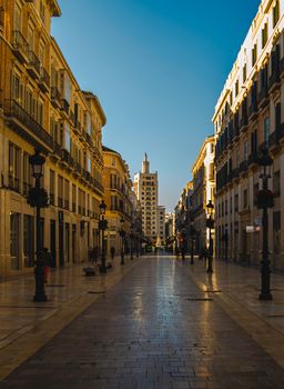 Captivating view of an empty pedestrian street in Málaga, Spain, showcasing classic architecture.