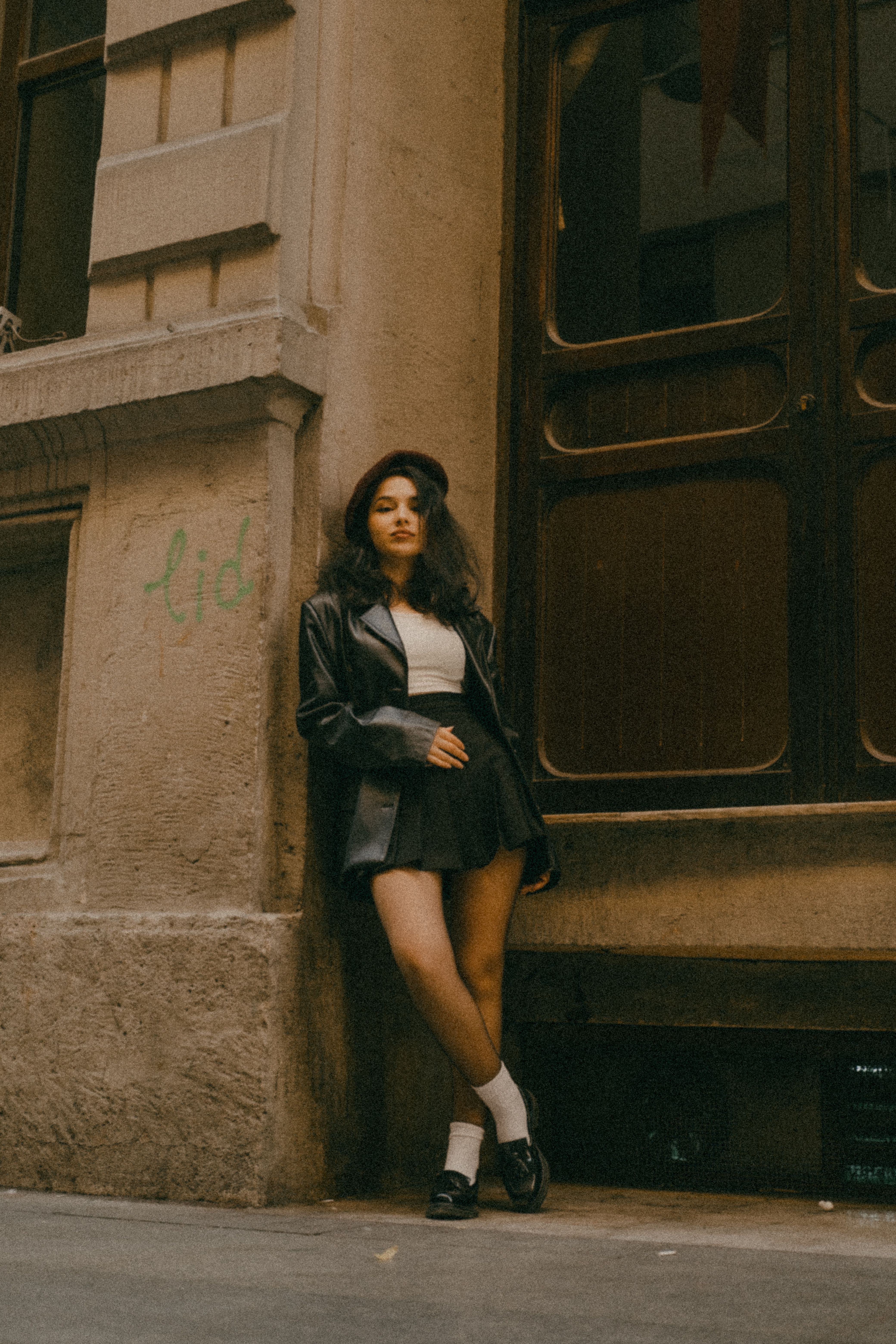A Woman Leaning on a Concrete Surface · Free Stock Photo