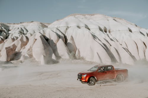 Pick-up Truck Driving on a Desert