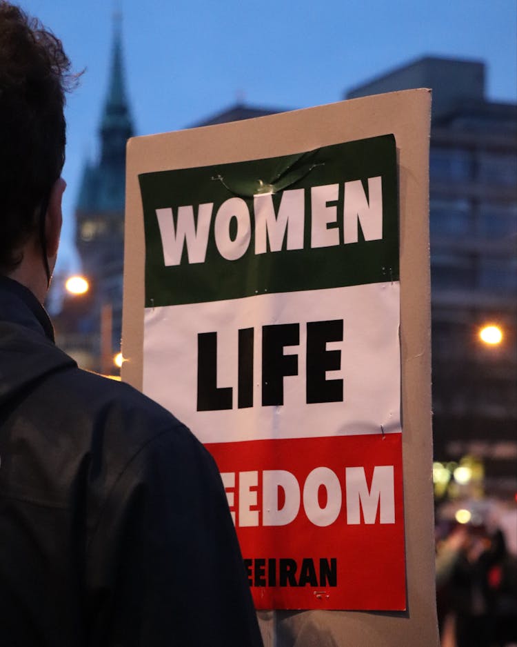 Person Holding Protest Sign